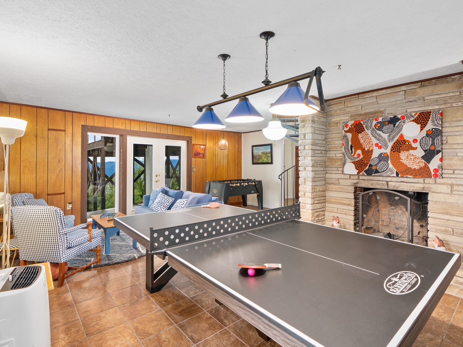 Game room with ping pong and fireplace